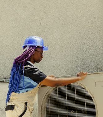 Technician dismantling hvac system